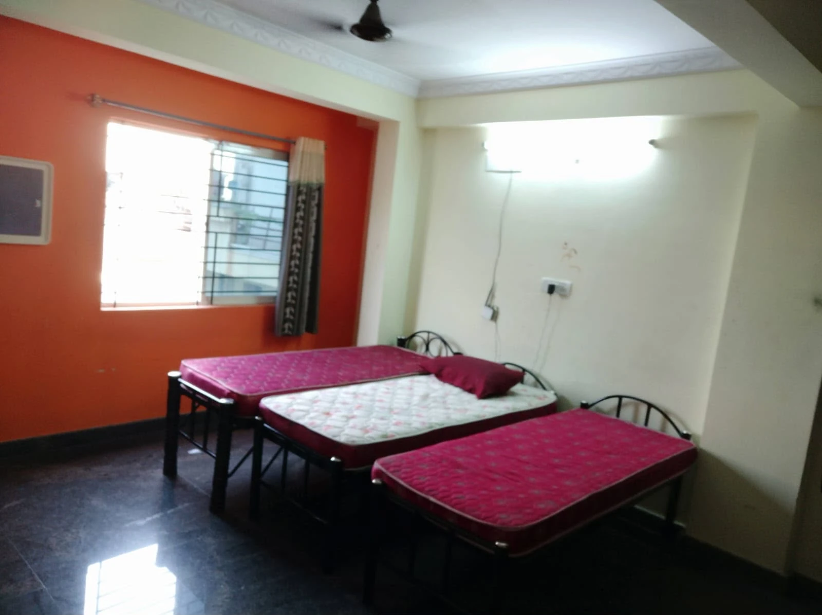 Spacious three-sharing room at Gayatri Luxury Gents PG