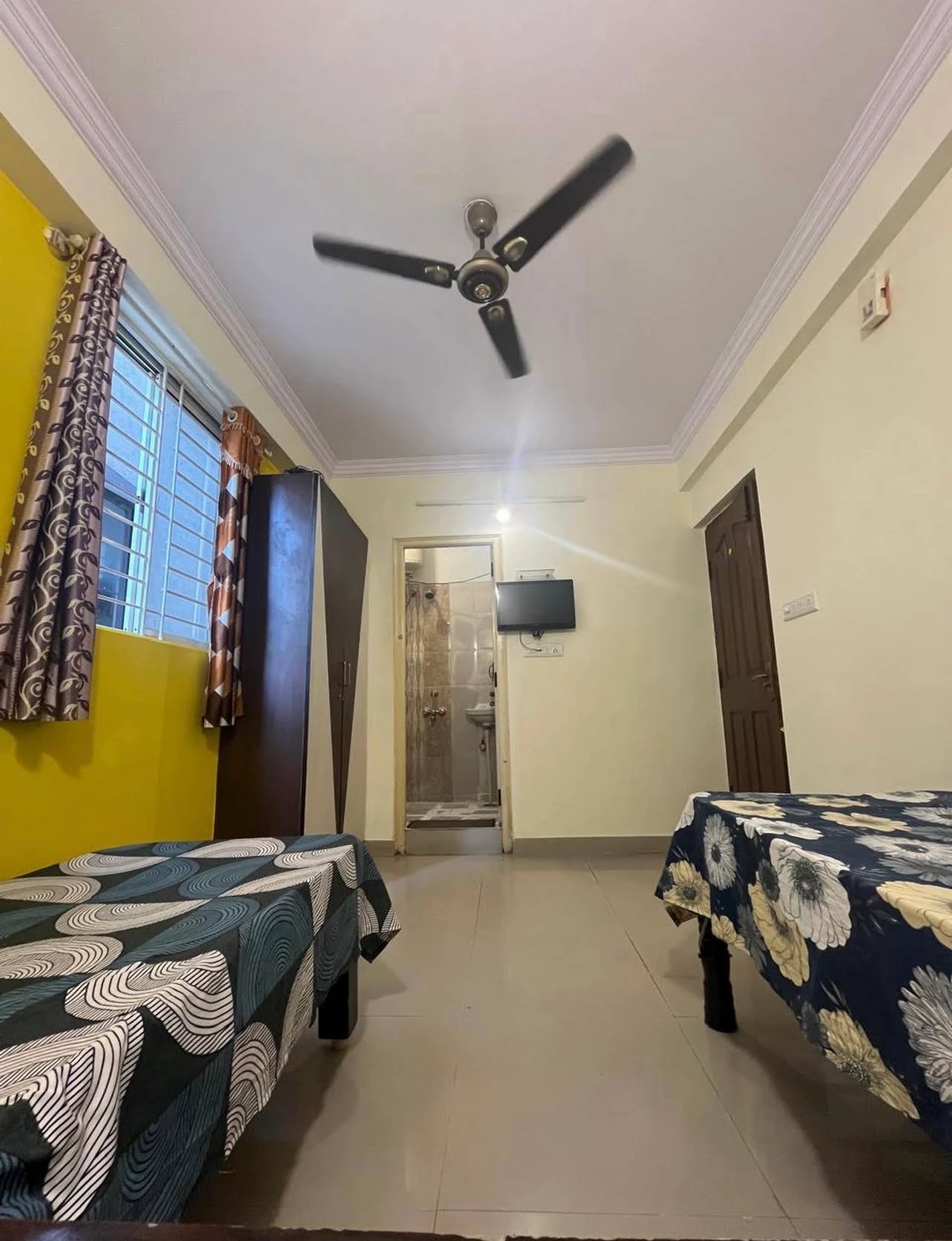 Gayatri Luxury Gents PG room with beds, wardrobe and attached bathroom